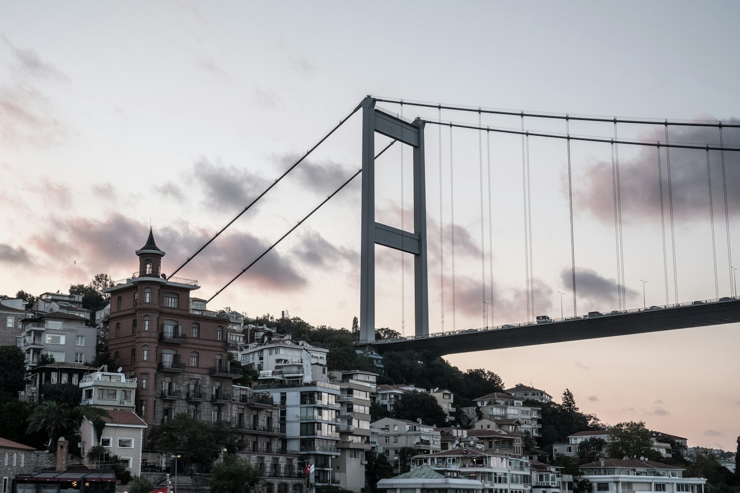 The Bosphorus Bridge over waterside houses, Istanbul