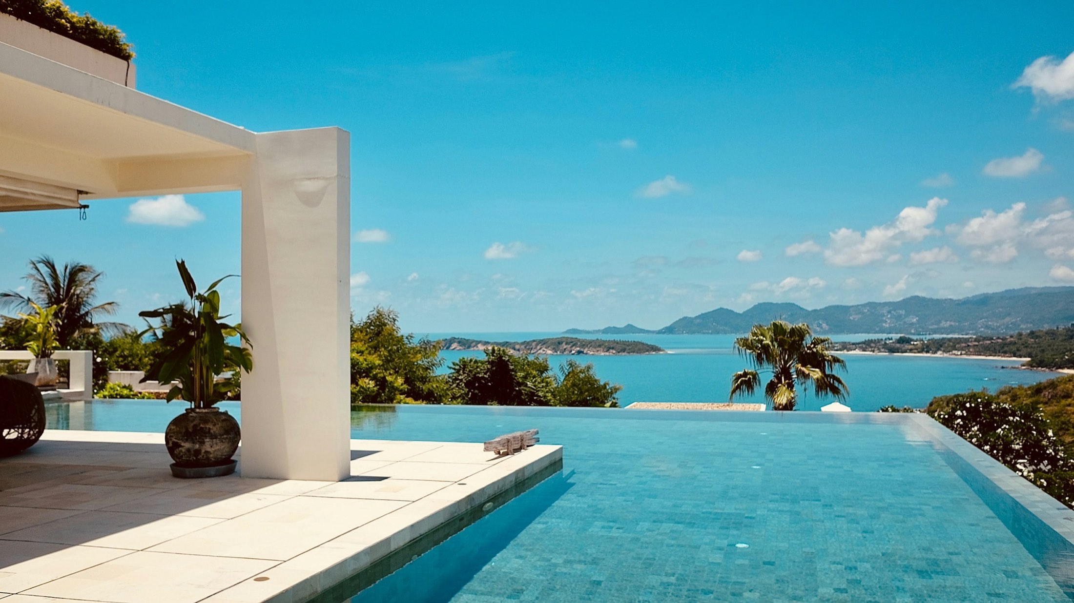 An infinity pool above a bay